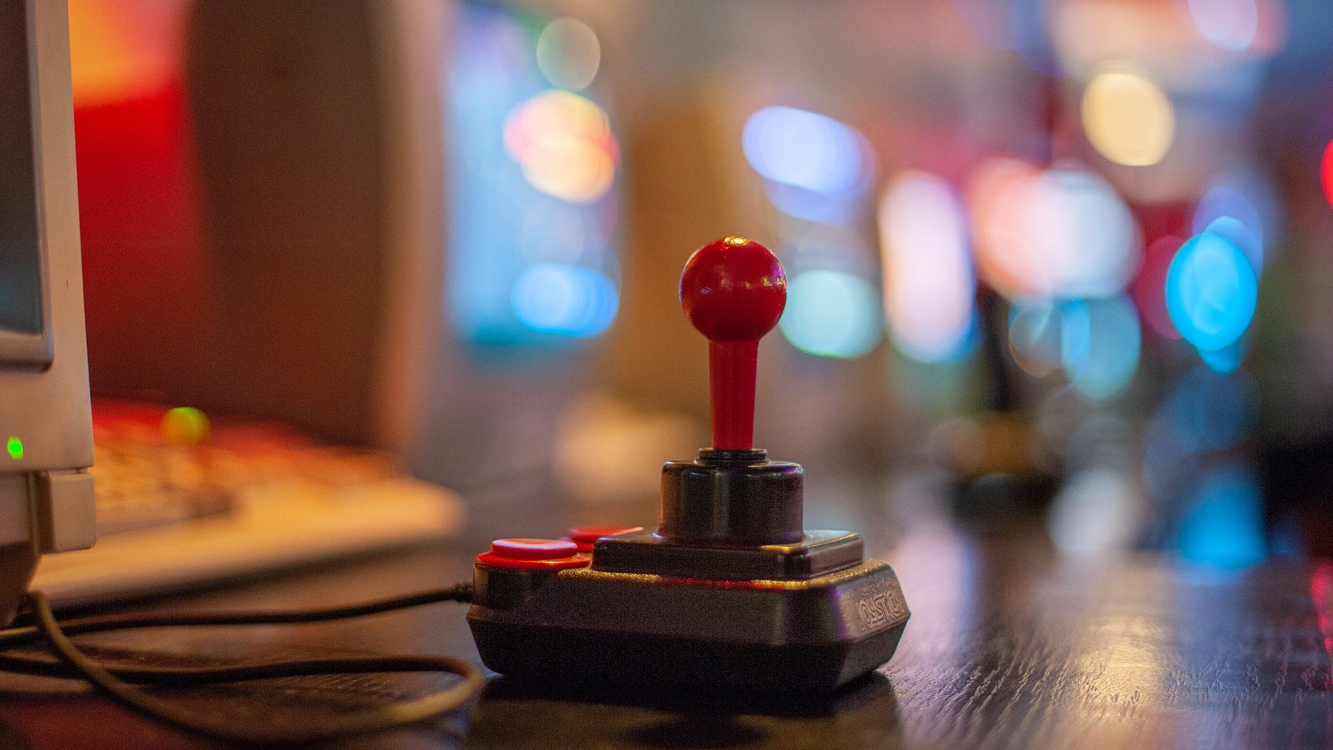 Joystick in front of old computers